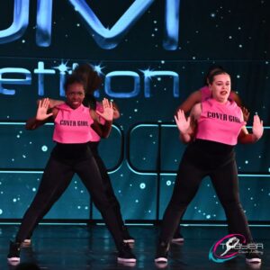 dancers in pink and black costume